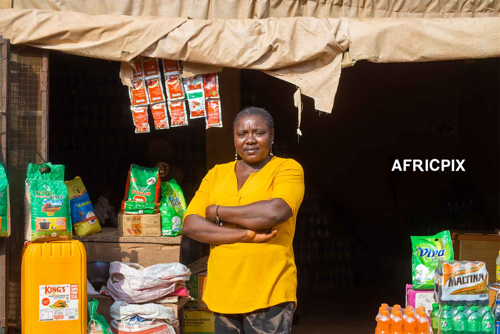 Nigeria Market Woman In Front of Shop
