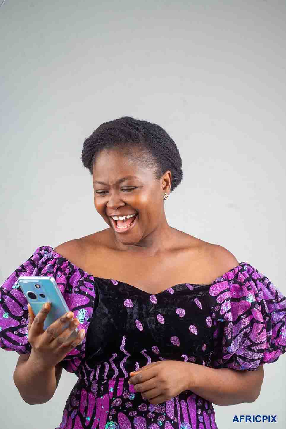 Happy Nigeria Woman Looking At Phone