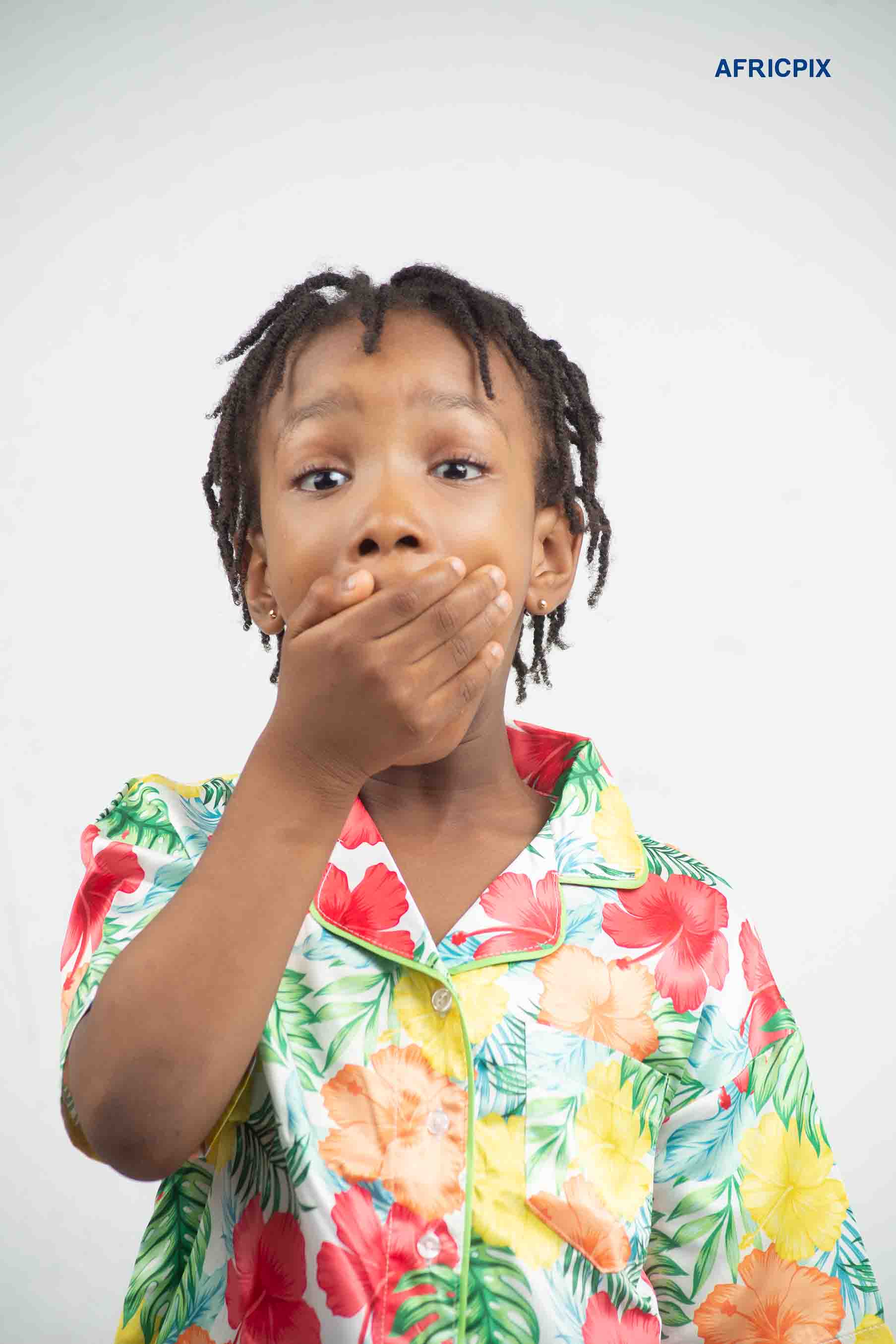 Happy Nigeria Child Girl Hand on Mouth