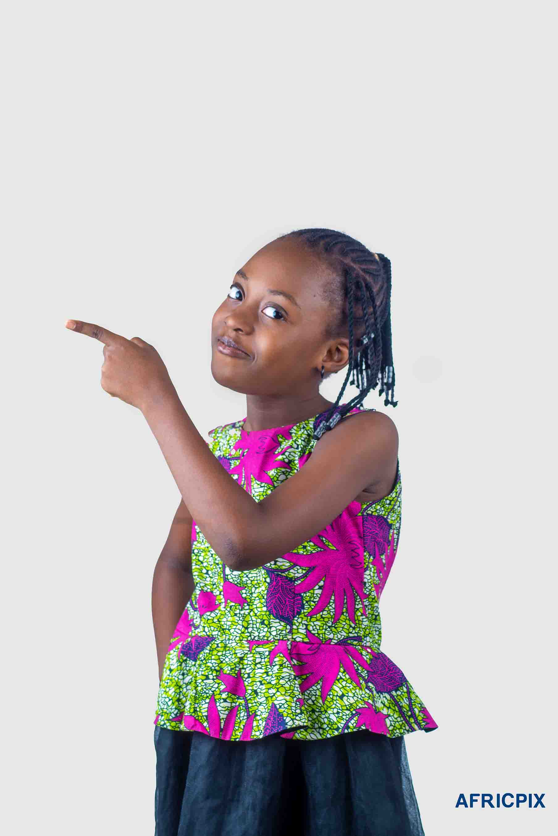 Nigerian Child Girl Wearing Native Pointing Sid Smiling